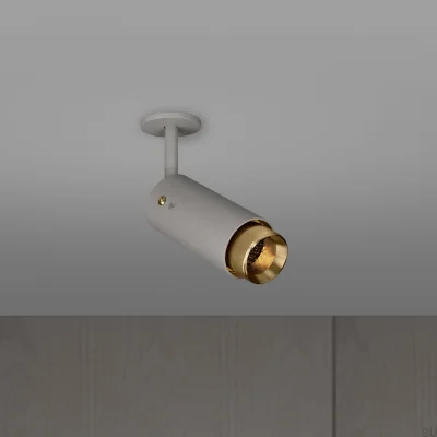 Projecteur linéaire orientable à extraction de courant, gris acier avec laiton